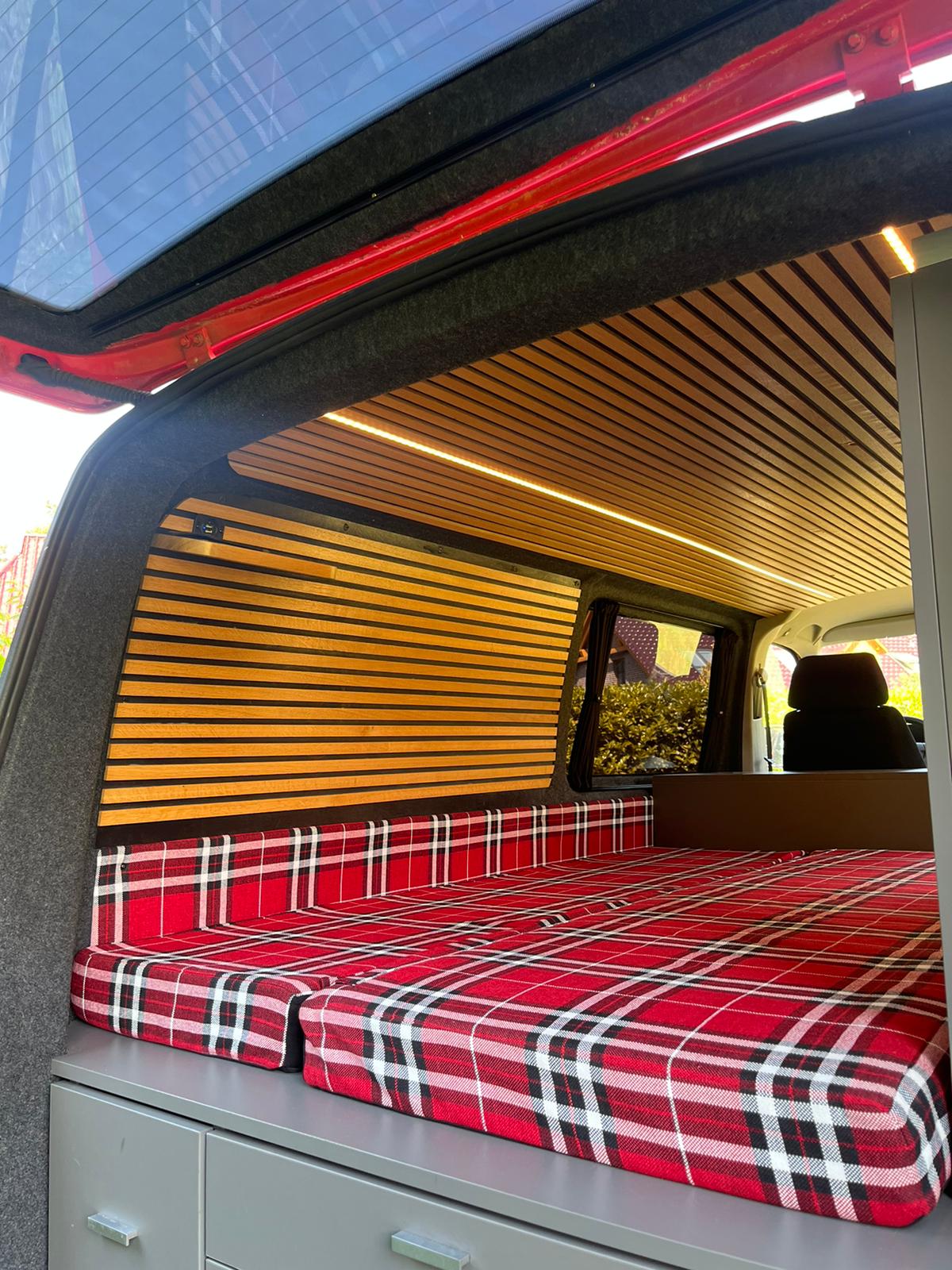 Van view from behind with an open bed